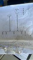 Instruction diagram showing the chandelier frame parts and assembly method.