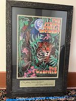 Framed concert poster for String Cheese Incident at The Warfield 2000 featuring a leopard and jungle theme, with an artist's signature and written note below.