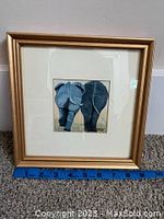 Framed print showing the full artwork and frame with ruler for scale.