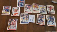 Photo showing 15 hockey cards from 1994 Upper Deck series arranged on a table, with visible minor wear on some cards.