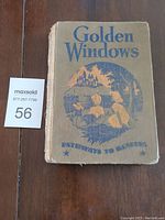 Front cover of Golden Windows hardcover book showing title and illustration.