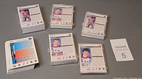 Multiple stacks of MacDonald hockey cards from 1992 and 1993, showing backs with player stats and information, some cards partially visible in front.