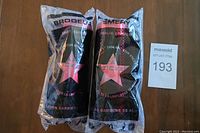 Photo of two Brodeur & Emery 2008 Star Sticks goalie sticks in original sealed packaging.