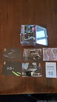 Stack of Star Wars 1997 cards with album wallet and select cards displayed showing ship images and card backs