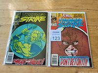 Two Marvel comics featuring Thunder Strike, one with 'Smash Their Blood!' cover and one with Juggernaut from X-Men crossover.