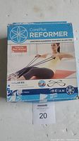Boxed Gaiam CorePlus Reformer showing front with product name, imagery of person exercising, and brand logo.