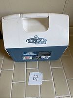 Playmate MaxCold cooler closed, showing top handle and logo.