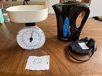 Image showing vintage food scale and Proctor Silex electric kettle on wooden table with lot number tag.