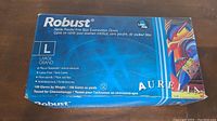Box of Robust large nitrile powder-free blue examination gloves, showing front top side with logo and size details.