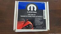 Box of MOPAR Car Care Kit with product list displayed
