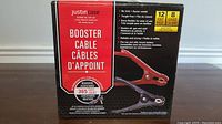 Front view of the booster cables packaging showing brand Justin Case and product features such as 12 feet length and 8 gauge cable.