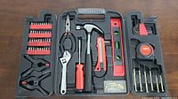 Top-down view of entire tool kit in open black plastic case showing all tools organized in molded slots.