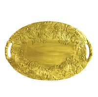 Full top view of the gold ceramic oval serving platter featuring embossed autumn leaves on the rim with handles on both ends.