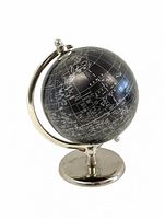 Photo showing a small black globe with silver writing and markings, mounted on a silver metal stand with a circular base.