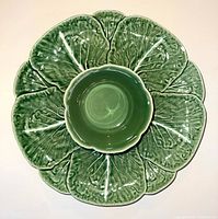 Top-down view showing leaf-veined serving platter with central bowl