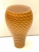 Full view of amber glass pendant light cover with textured wave pattern.