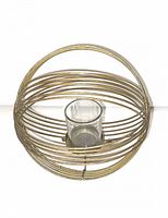 Photo showing gold metal wire spherical votive candle holder with clear glass insert in the center.