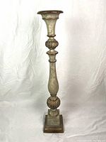 Full view of tall antique-style candle holder showing overall shape, classical design, and height.