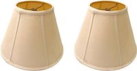 Pair of beige linen lampshades shown side by side, highlighting shape and fabric texture.