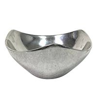 Modern abstract shaped silver chrome bowl with reflective surface in good condition, shown on white background.
