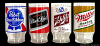 Set of four vintage beer glasses bearing Pabst Blue Ribbon, Carling Black Label, Schlitz, and Miller High Life logos in vibrant colors