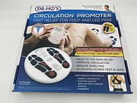 Box front showing Dr Ho's Circulation Promoter for foot and leg pain relief with product benefits and professional TENS device labeling