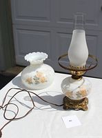 Photo showing the full lamp including base, frosted chimney, and separate milk glass globe with floral design.