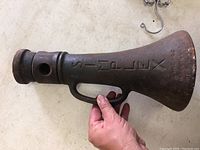 Photo of the Simplex car jack showing the embossed text 'SIMPLEX' and part of the rusted surface.