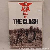 Front cover of DVD showing The Clash performing live with title and red star graphic.