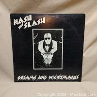 Front cover of Nash The Slash Dreams and Nightmares vinyl record, showing artist photo and title.