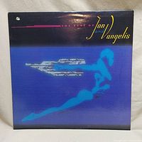 Front cover of 'The Best of Jon and Vangelis' vinyl record album showing stylized blue figure and album title.