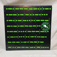 Front of vinyl album cover shows black cover with green Morse code and Radio KAOS logo.