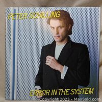 Front cover of Peter Schilling's vinyl album "Error in the System," showing artist image and album title in yellow text.