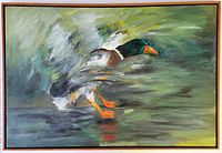Framed oil painting of a mallard duck in flight. Scene features a green-headed duck with vibrant orange legs and beak amid a dynamic mix of bold brush strokes. Vintage wood floating frame surrounds the canvas.