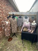 Image showing five mannequins dressed in various ladies' animal print dresses and tops, along with a leopard print hat on one mannequin.