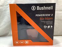 Front view of new Bushnell PowerView 2 binoculars in original packaging showing brand, model, and magnification.
