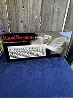 Front view of the IBM Rapid Response keyboard box showing product name, image, and descriptive text.