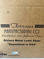 Box of Torrans Riviera Metal Lawn Chair showing brand, model and origin labeling.