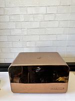 Front view of the breadbox showing copper metallic lid and handle
