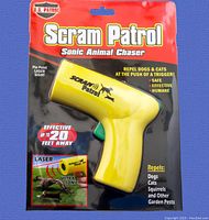 Front view of sealed U.S. Scram Patrol Sonic Animal Chaser packaging showing yellow device and branding details.