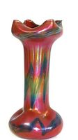 Full view of vase showing overall shape, iridescent red finish and pulled feather pattern