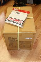 Box of 25 G-Force racing Nomex flame-retardant underwear tops in sealed packaging, size Small, original box labeled and sealed.