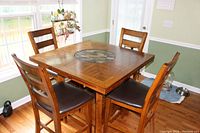 Full assembled set showing square table and four chairs in dining area