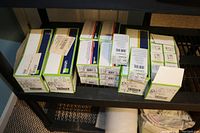 Shelf of multiple Leviton product boxes showing packaging sizes and branding.