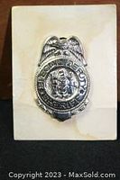 Front view of one silver-tone vintage metal Special Deputy Sheriff badge from the 1950s showing embossed eagle and central star emblem.