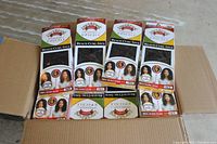 Box containing 39 packs of Beach Curl human hair weave extensions, each pack includes 4 pieces.
