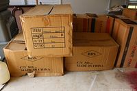 Box labeled with item info, color F30/144, quantity 100, made in China