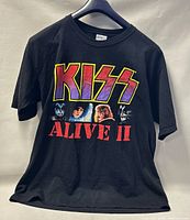 Front view of black KISS ALIVE II T-shirt showing logo and band member images