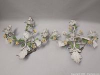 Front view of both sconces showing overall floral design