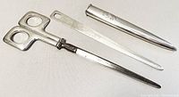 Full view of 3-piece vintage sterling silver desk set showing scissors, letter opener with monogrammed sheath, and holder.